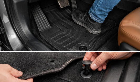 Driver-side car floor mat securely fixed in place inside a vehicle