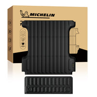 MICHELIN custom-fit black heavy-duty truck bed mat and tailgate mat set. Features a thick, durable construction with deep vertical drainage channels and a non-slip textured surface, precisely molded to accommodate wheel wells for ultimate cargo protection, scratch resistance, and all-weather defense.