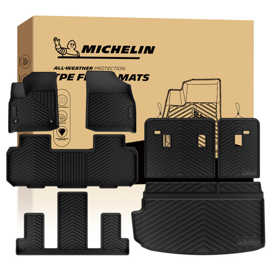 MICHELIN premium black all-weather TPE custom-fit car floor mats, trunk cargo liner, and seat back protector set exclusively designed for 2018-2023 Chevy Traverse and 2024 Traverse Limited 7-seat models. Includes 1st, 2nd, and 3rd-row mats, along with split rear seat backrest protectors featuring precise cutout details, and a main trunk mat, utilizing high-density TPE for complete waterproof interior coverage.