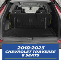 Real-world installation of the custom-fit MICHELIN black TPE rear trunk cargo mat and seat back protectors inside a 2018-2023 Chevrolet Traverse 8-seater. Demonstrates precise edge-to-edge fitment perfectly accommodating the 3rd-row seats for comprehensive waterproof cargo protection.