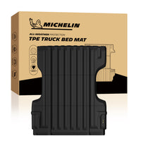 Michelin Nissan Frontier 6 FT 2005-2021 truck bed mat shown in front of branded retail packaging box
